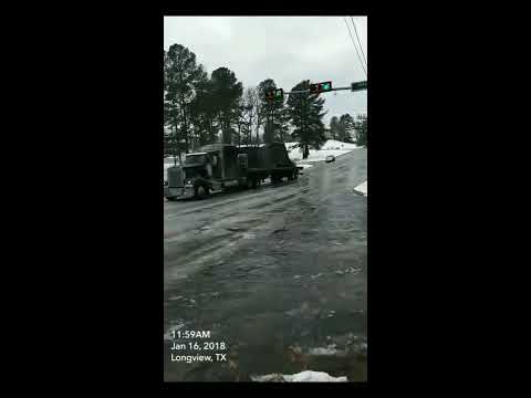 truck on icy hill hits stop light - 981828